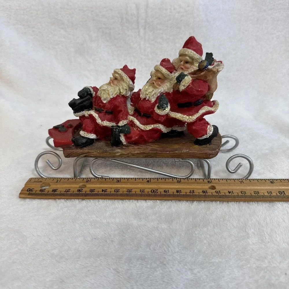 Three Jolly Santas Riding On a Sled‎ Christmas Figurine Vintage 90s